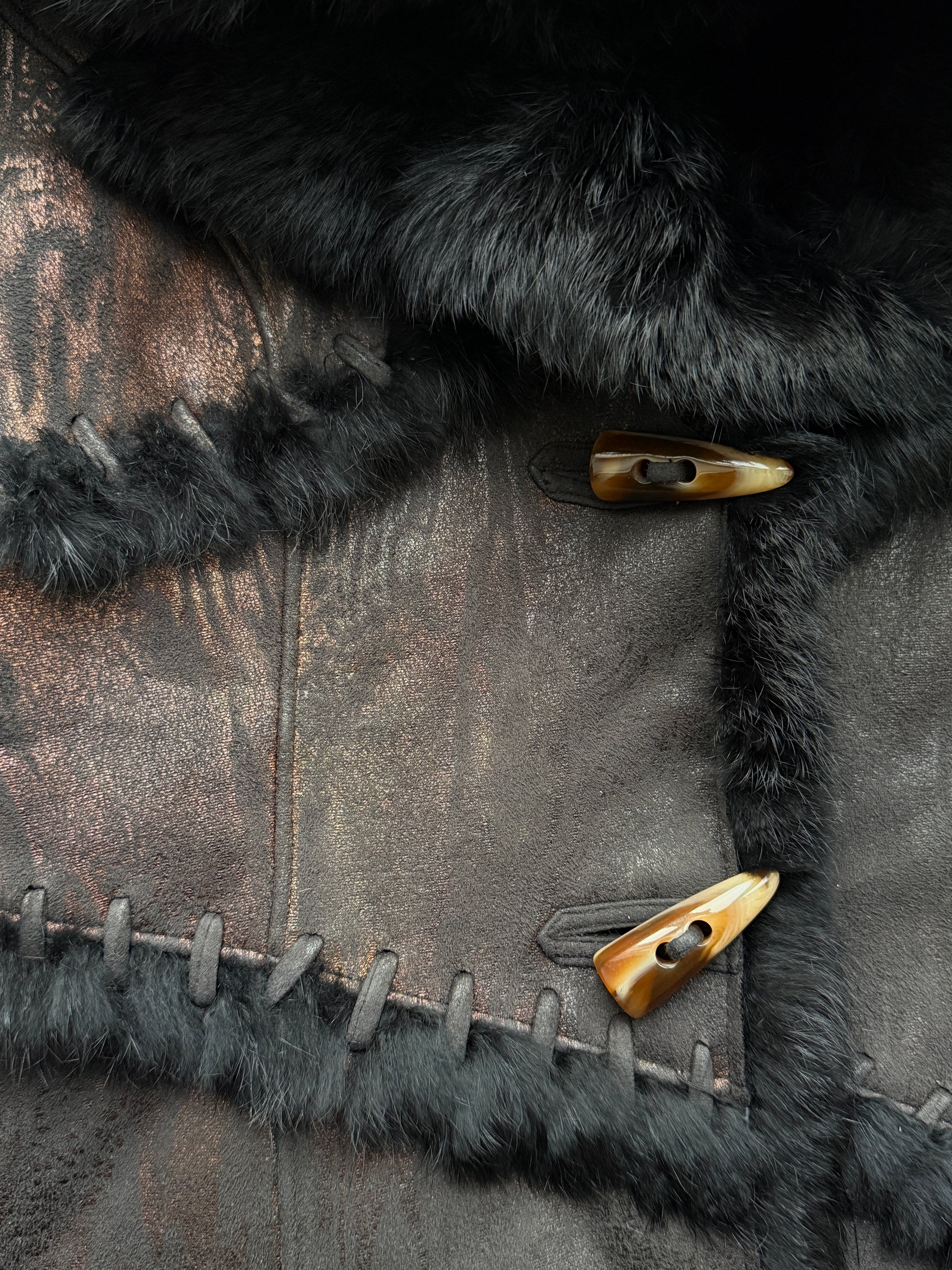 Metallic paneled shearling-trimmed leather jacket
